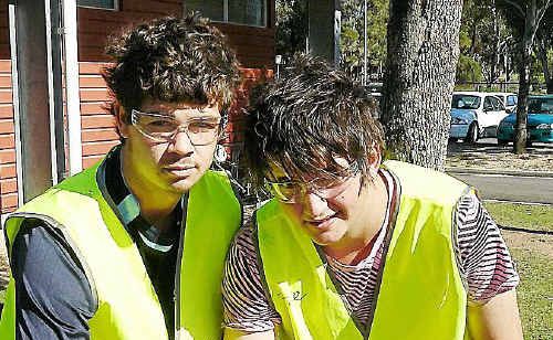 Warwick State High School students Brock Eastwell and Jacob Magarry paint their way through their Construction Pathways program. Warwick State High School students Brock Eastwell and Jacob Magarry paint their way through their Construction Pathways program.